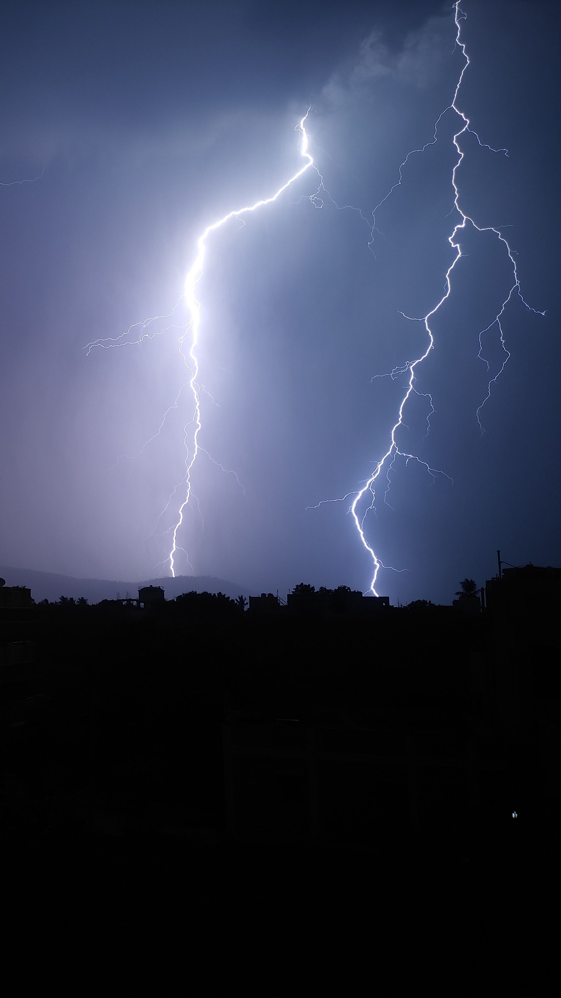 Lightning splitting the night sky during a storm